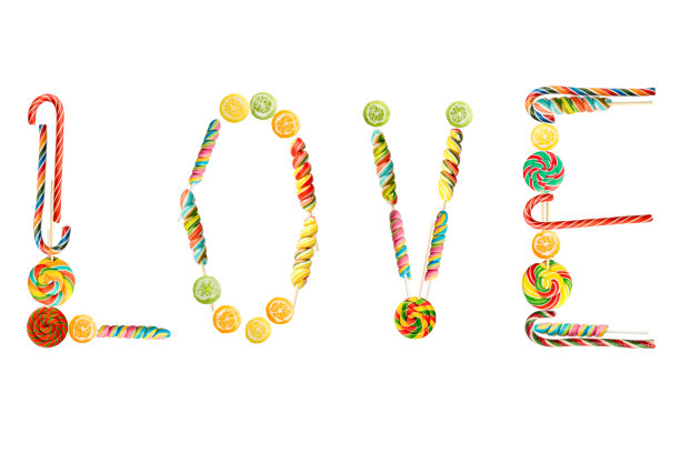 从彩色拐杖糖孤立在白色背景的单词爱。焦糖糖果，棒棒糖用来设计情人节贺卡，母亲节图片下载