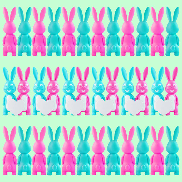 粉红色和蓝色的兔子图案。可爱的小兔子套装，幸福的情侣与心在白色的背景。复活节横幅设计图片下载