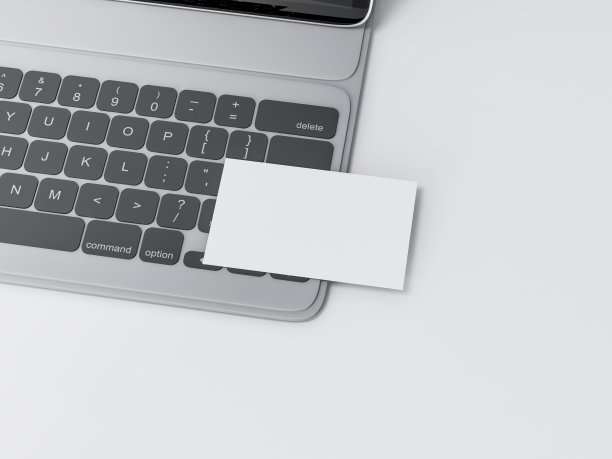 白色名片模型上的黑色数字平板键盘上的白色桌子图片下载