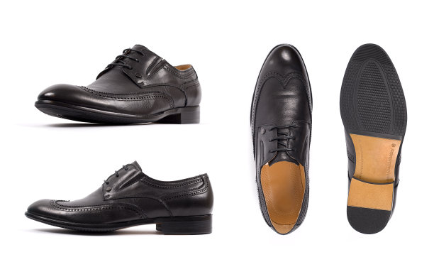 男士的鞋是黑色的，鞋底孤立白色。侧视图，俯视图和鞋底图片下载