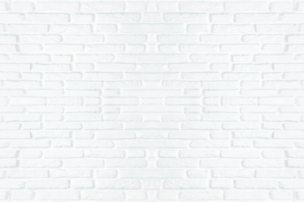 白色的砖墙为纹理背景的石材砖块，涂以灰色的浅色壁纸，现代的室内或室外和背景设计。图片下载