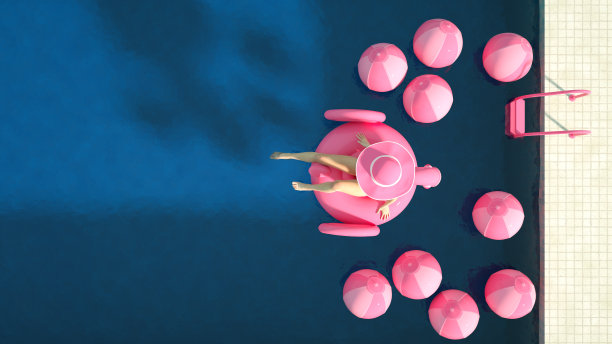 性感的女孩在一个粉红色的比基尼日光浴与充气火烈鸟，夏天的概念图片下载