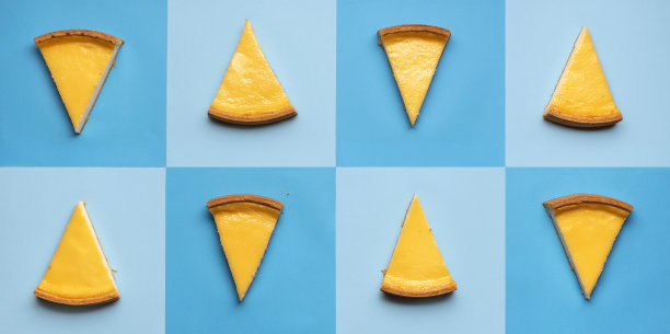 芝士蛋糕片拼贴着蓝色的方块。甜点拼贴图片下载