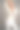 自信的金发女人穿着白衣服在工作室摆姿势图片下载