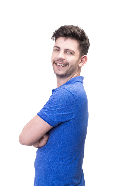 英俊的年轻男子的肖像看在一个白色的背景上的微笑相机的肩膀图片下载