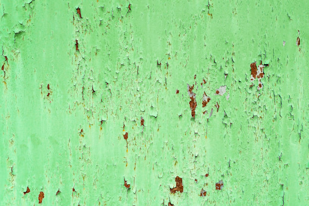 旧漆的金属照片。油漆下面生锈了。图片下载