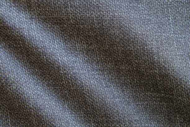 选择性聚焦，近距离拍摄深灰色正装布织物表面。羊毛织物质地，用于重要的豪华晚会或夜间活动。壁纸和背景与文本复制空间图片下载