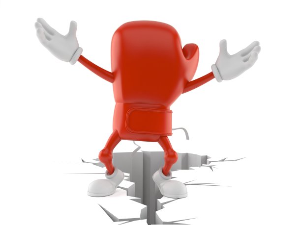 拳击手套人物站在裂开的地面上图片下载