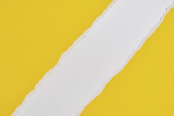 撕破的纸边缘与副本空间，白色和黄色的背景图片下载