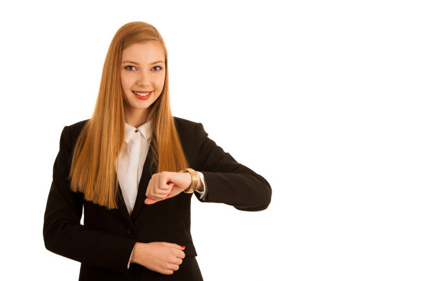 年轻的女商人检查孤立的白色背景手表图片下载