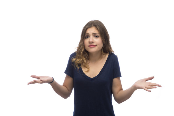 困惑的年轻美丽的女人，孤立在白色的背景图片下载