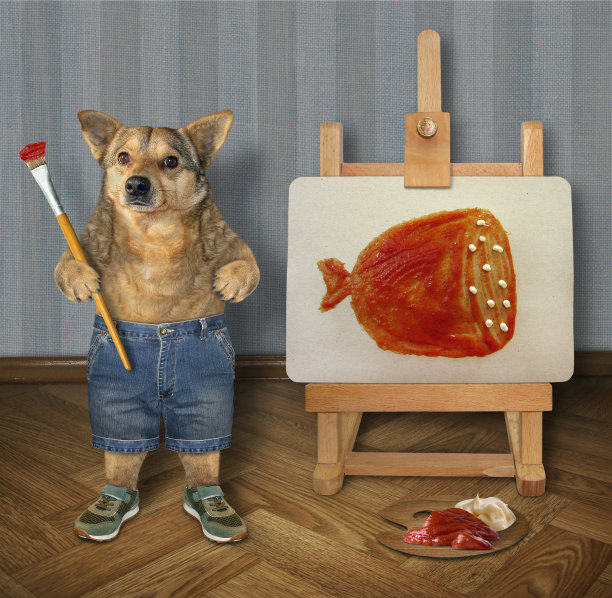狗画家在画布上作画图片下载