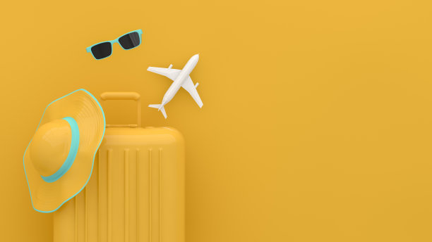 黄色背景的手提箱，简约的旅行概念图片下载
