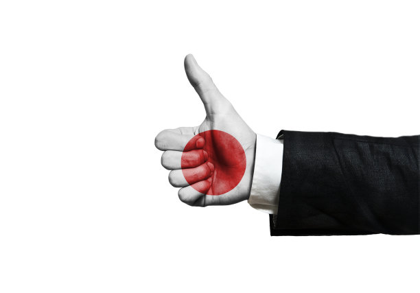 竖起大拇指和日本国旗的商人图片下载