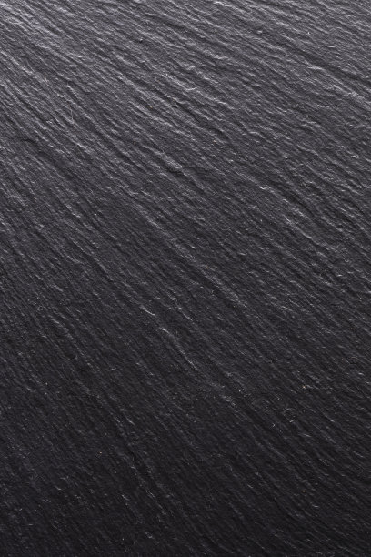 黑色石材，背景纹理。结构表面平滑的阴影和光线，垂直照片图片下载