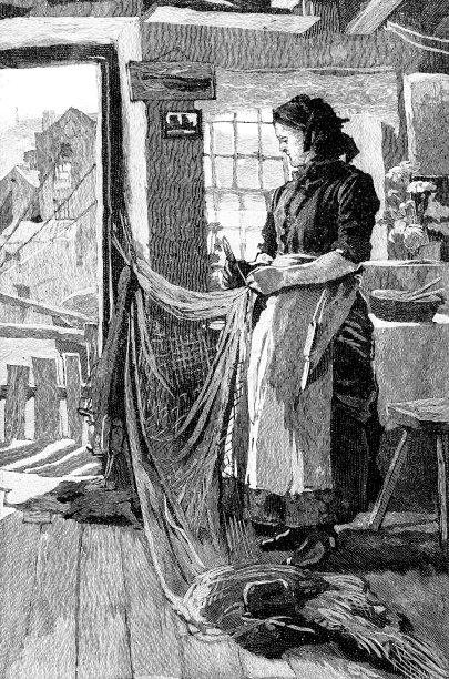 在北约克郡的斯泰思，一位老渔夫正在修补渔网素材图片