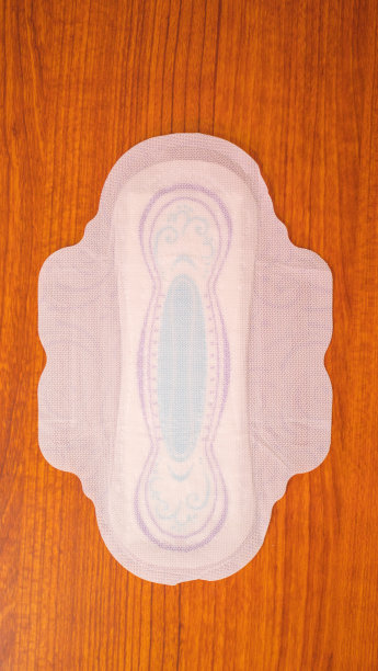 红色背景的经期卫生巾。危急的妇女，月经周期妇科。月经是女性为血液周期的卫生。妇女的卫生图片下载