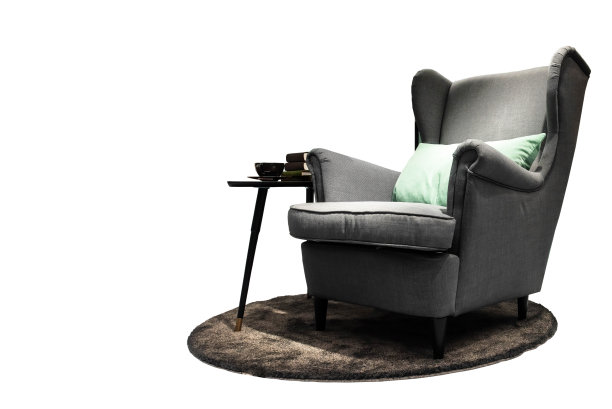 灰色的布质沙发，绿色的靠垫，咖啡桌套，天鹅绒的毕业舞会书籍，从背景剪报部分分开图片下载