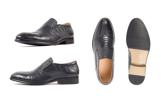 男士的鞋是黑色的，鞋底孤立白色。侧视图，俯视图和鞋底图片下载