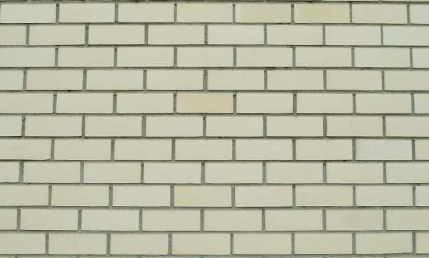 黄色砖墙纹理。枯燥乏味的砖墙。图片下载