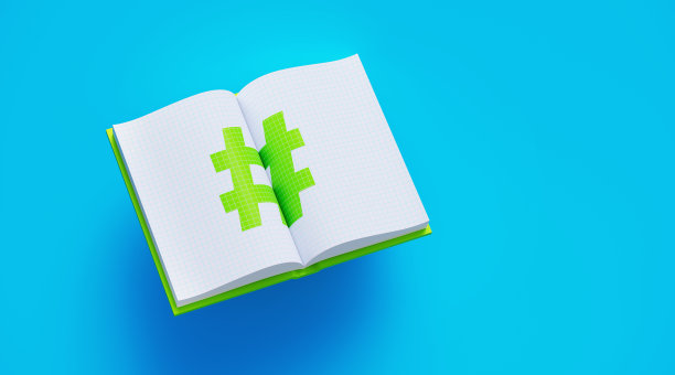 打开绿色的书与标签符号坐在蓝色的背景图片下载