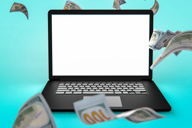 金融和经济概念落钱与便携式设备上的蓝色背景股票照片图片下载