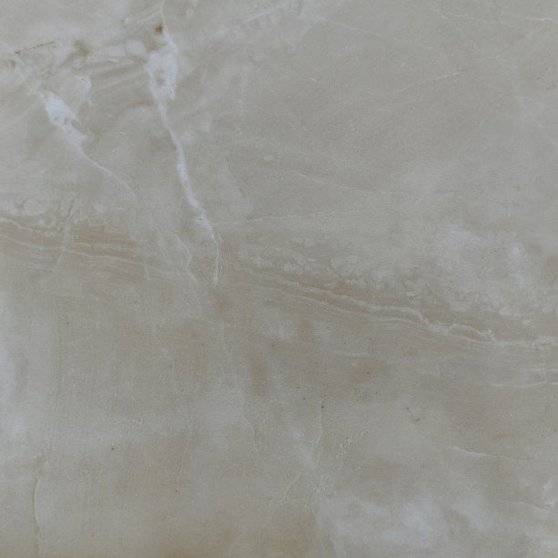 天然米色抛光大理石与一个倾斜的线分隔框架在一半和两个白色拉链从上角。图片下载