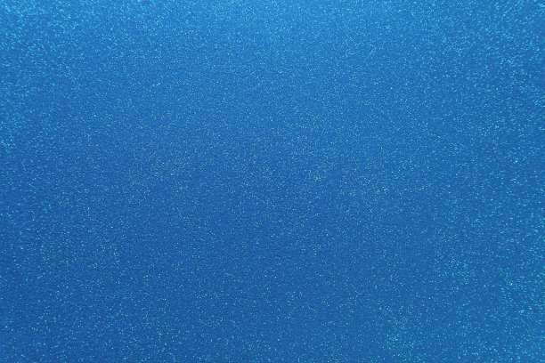 波光粼粼的蓝色背景。抽象闪光布，图案。辉煌的纹理图片下载