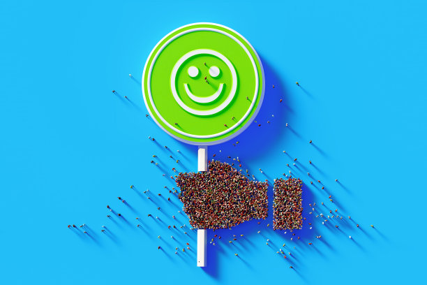 蓝色背景下的人群牵手形成绿色道路标志图片下载