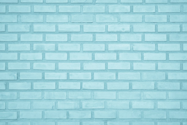 粉彩蓝白砖墙纹理背景。砖面漆成蓝色，内部岩石旧图案，干净的混凝土网格，不均匀的砖设计堆叠。家庭或办公室设计背景装饰。图片下载