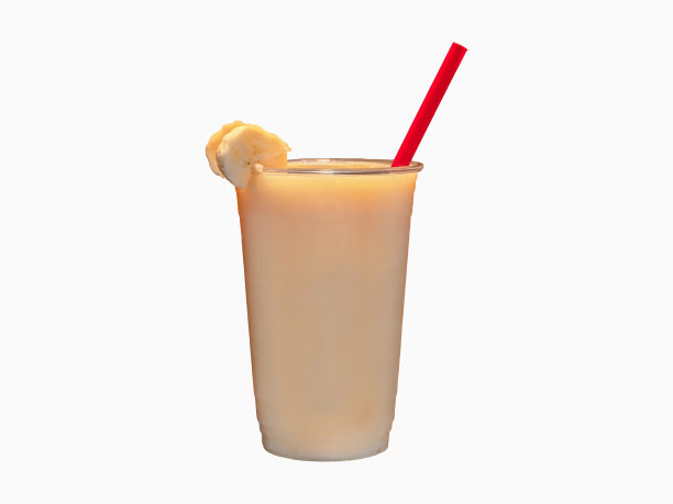 白色背景下的香蕉水果奶昔。图片下载