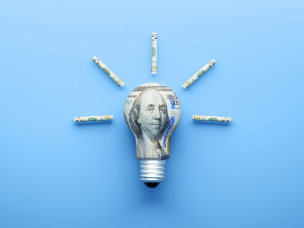 灯泡纹理与100美元钞票上的蓝色背景图片下载