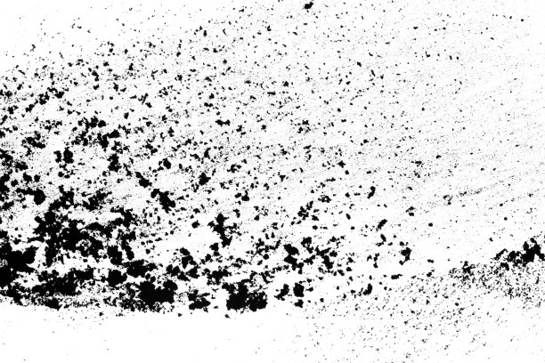 黑色的沙子孤立在白色的沙子上图片下载