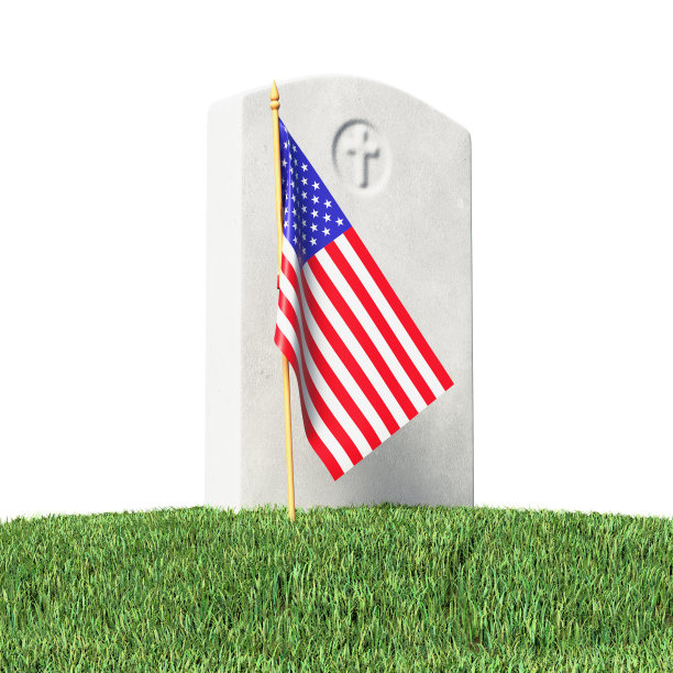 绿草上的小美国国旗和墓碑图片下载