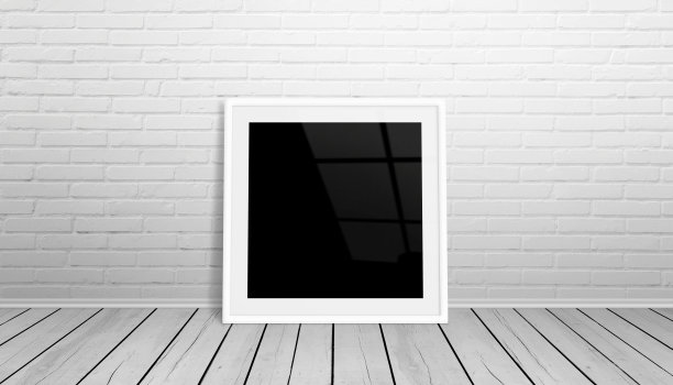 相框模型。孤立的框架艺术，设计展示。框架靠在白色砖墙上。木地板。图片下载