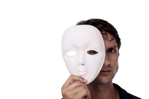 用白色面具遮住脸的商人，商业欺诈概念图片下载