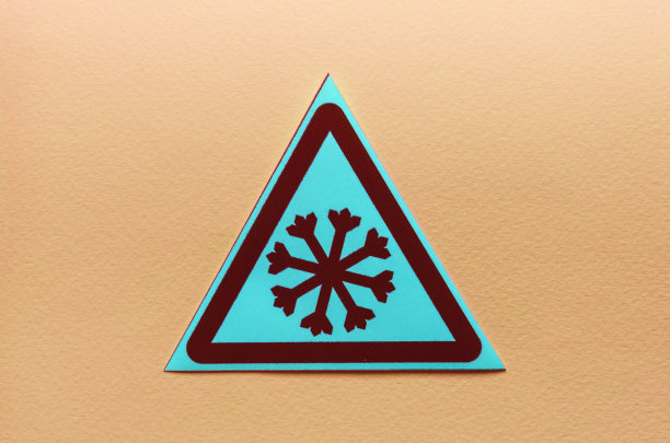 警告标志:黄色背景上的蓝色三角形雪花图片下载