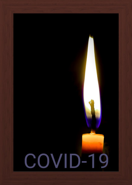 一根燃烧着的蜡烛，在一个黑色的背景上图片下载