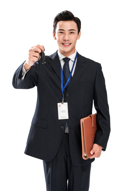 拿着汽车钥匙的青年销售人员图片下载