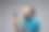 一名扮鬼脸的男子触摸着智能手机屏幕图片下载