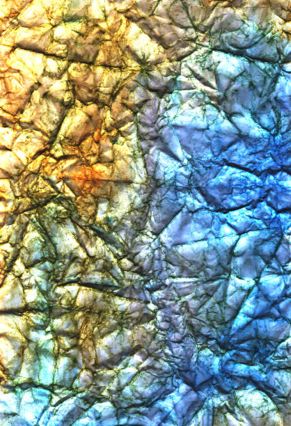 蓝色、黄色和棕色的皱巴巴的纸。皱纹彩色背景。墙纸。工艺页面。图片下载