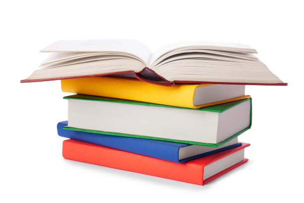 一堆彩色的书孤立在白色的背景上。收集不同的书籍。精装书供阅读。回归学校和教育的学习理念图片下载