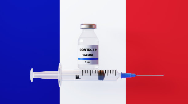 法国国旗上的COVID-19疫苗和注射器图片下载
