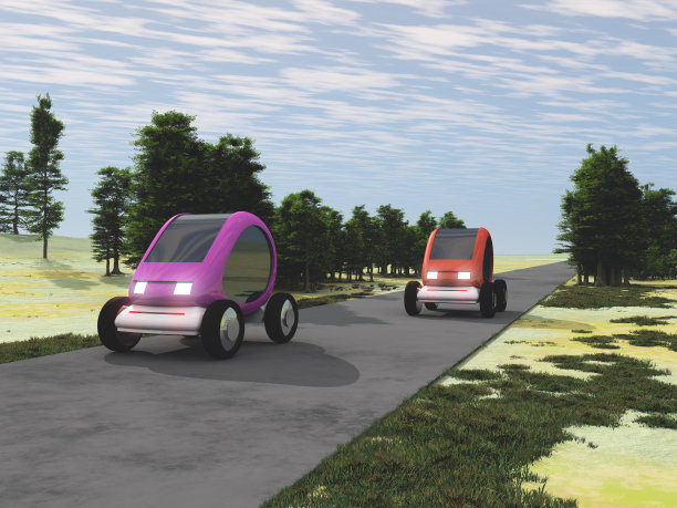 两辆自动电动汽车在路上行驶图片下载