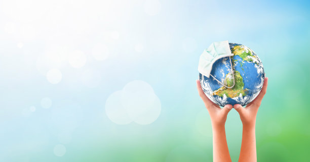 地球日概念:戴口罩抗击COVID-19病毒图片下载