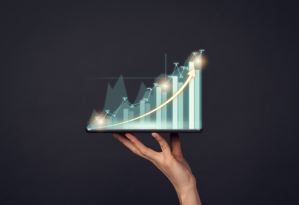 概念股票市场交易所。手持数字平板电脑，显示财务图表。图片下载