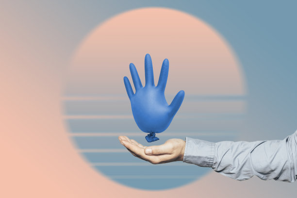 在一个抽象的背景上，人类拿着美丽的蓝色乳胶外科或医疗手套。冠状病毒概念，保护好自己。图片下载