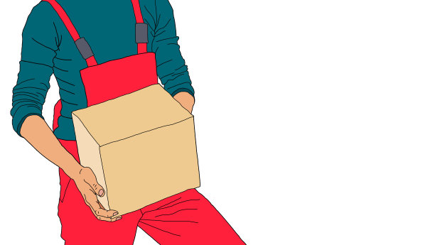 一个年轻人拿着一个盒子往一堆盒子里走。图片下载