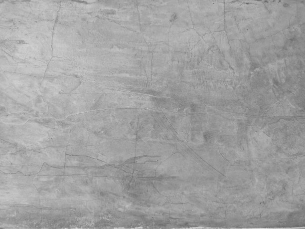 水泥墙面上的裂缝呈灰色，表面光滑抽象纹理为混凝土材料背景图片下载