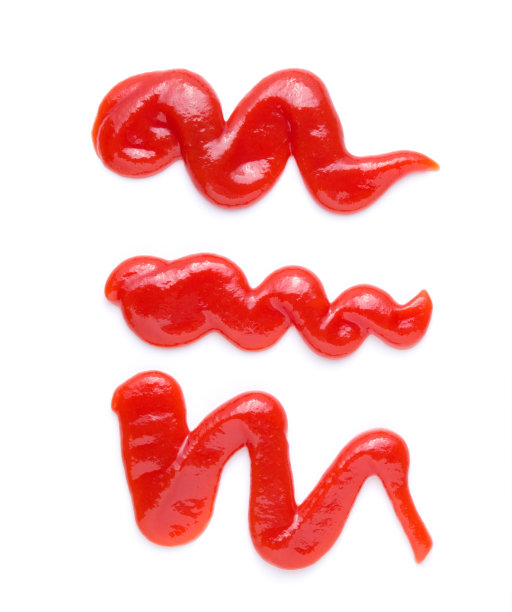 红色的番茄酱溅在白色的背景上，图片下载